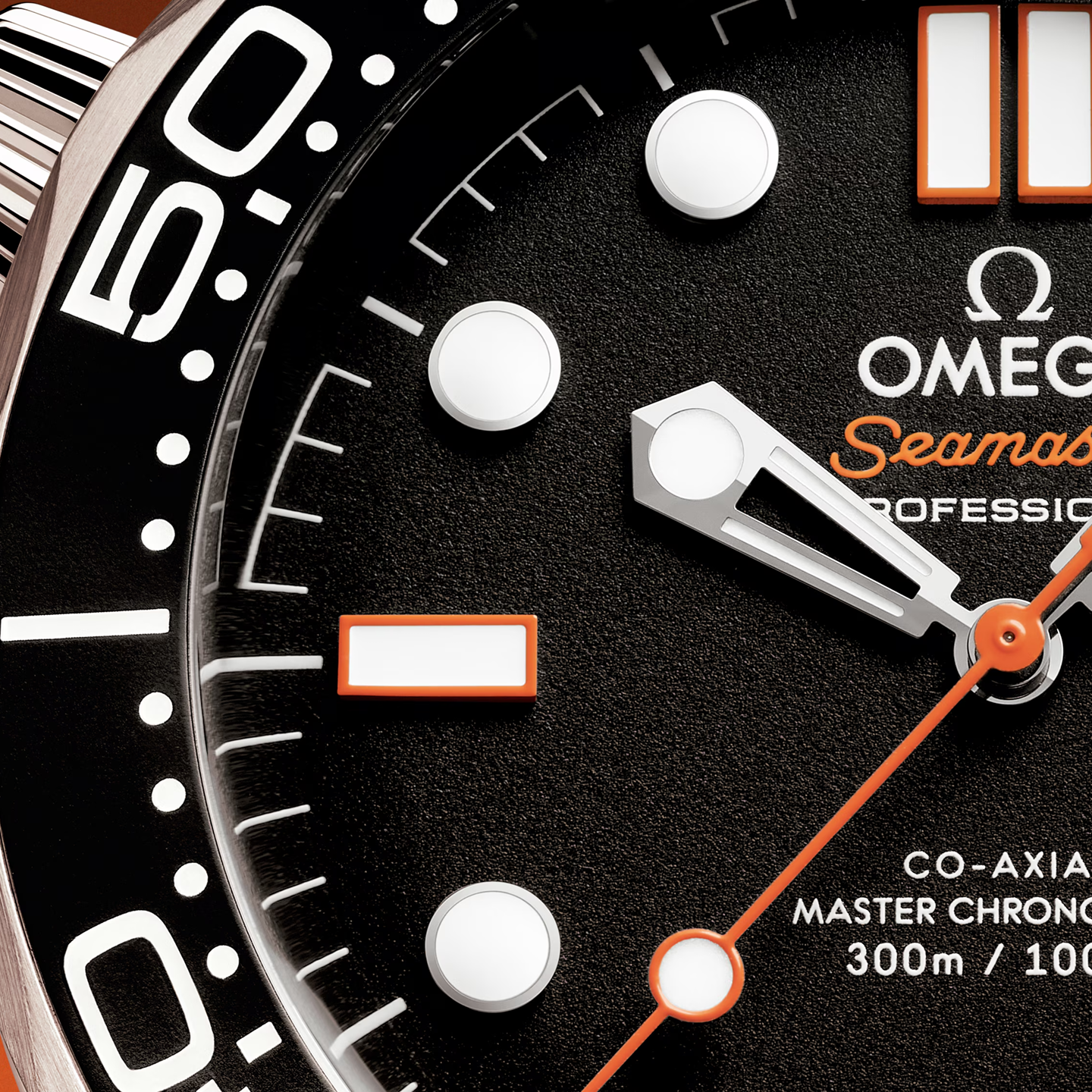 Close-up of an Omega Seamaster Professional watch face with black background and orange accents.