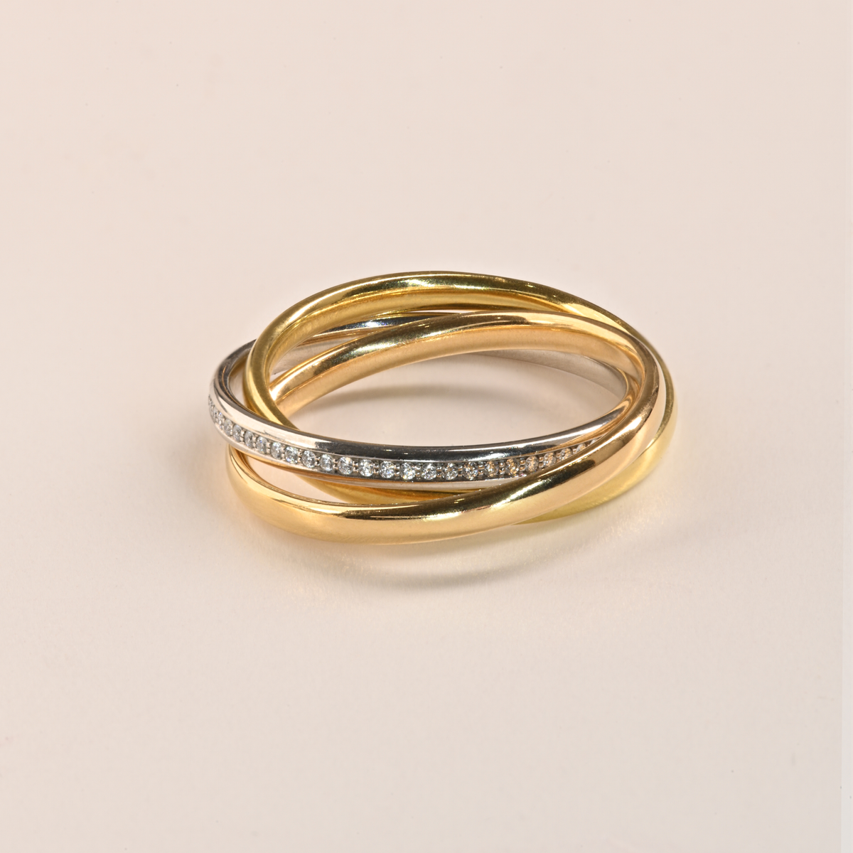 Beards 18ct yellow, rose and white gold interlocking ring